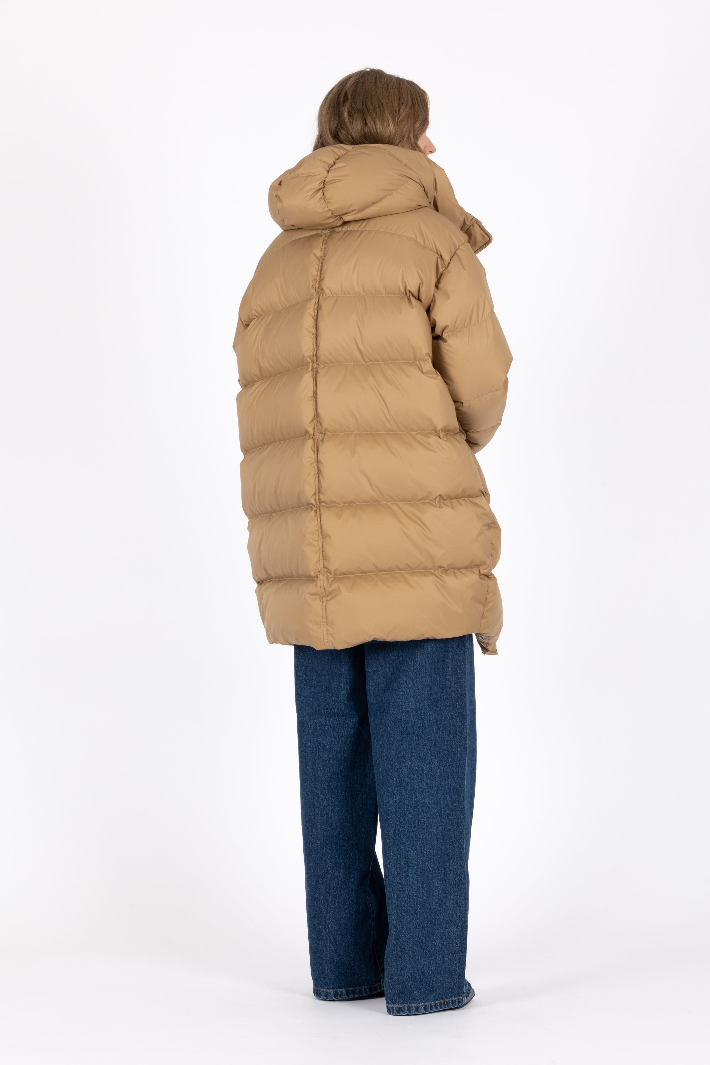 Mid‑length down parka with a cocoon shaped silhouette