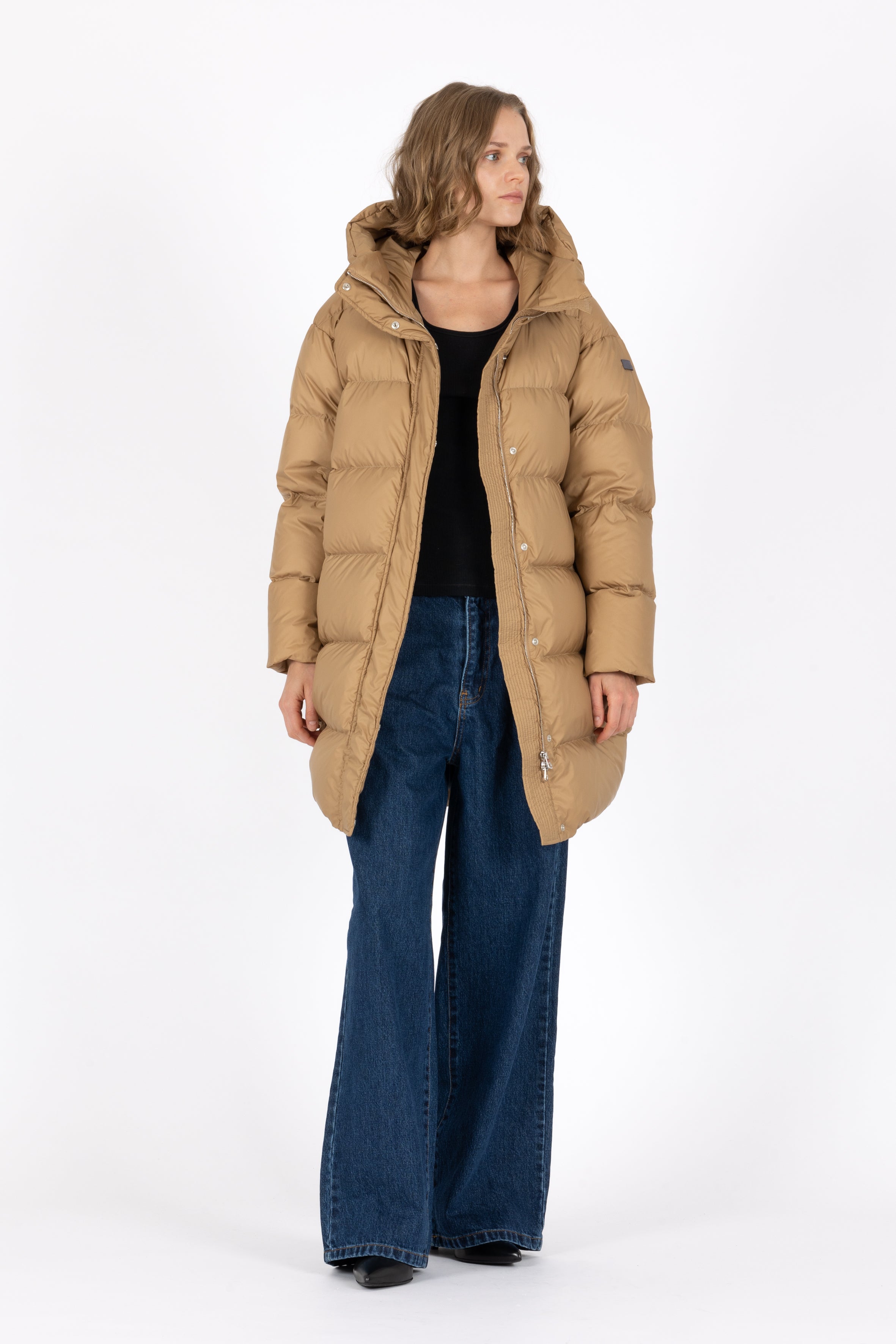 Mid‑length down parka with a cocoon shaped silhouette