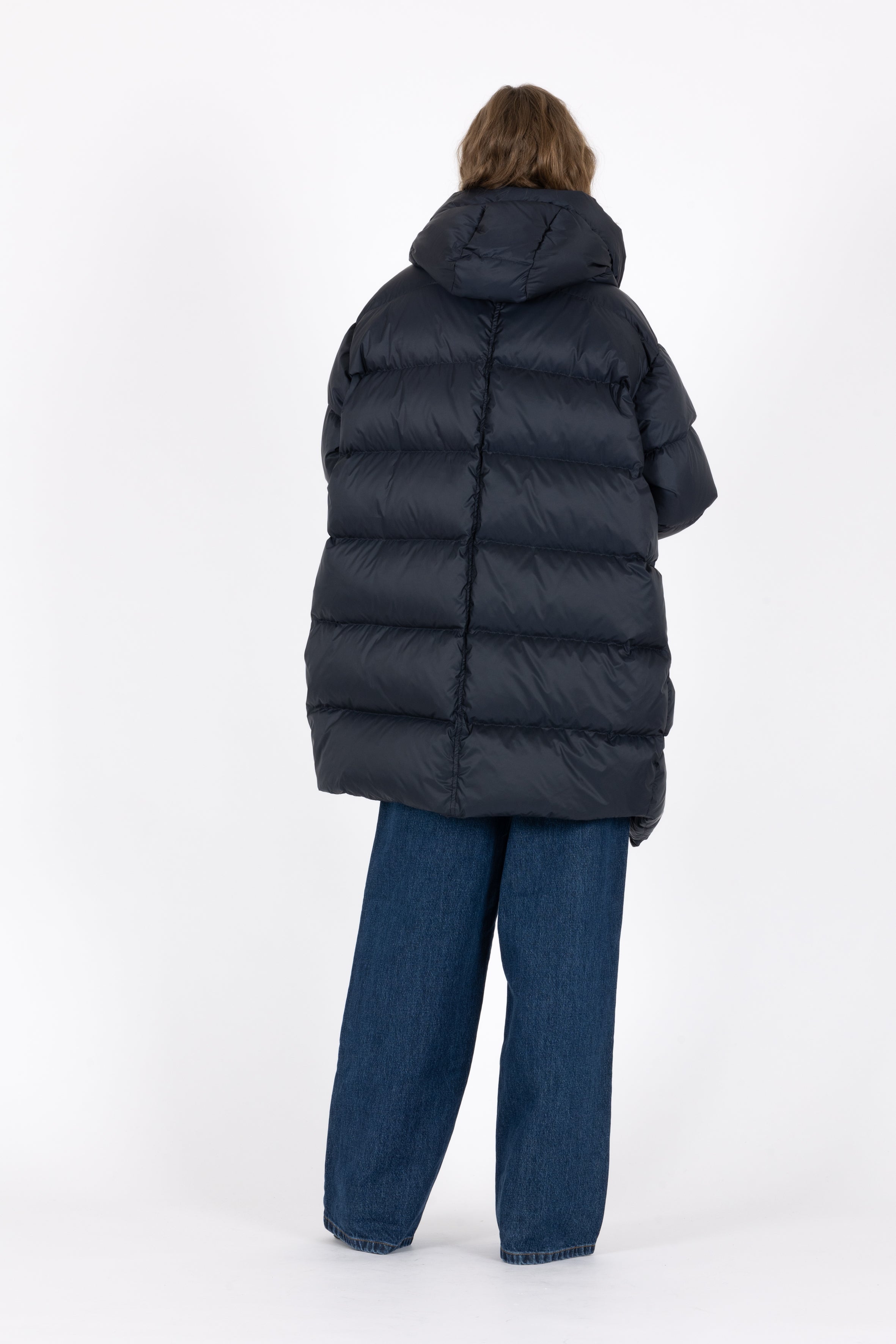 Mid‑length down parka with a cocoon shaped silhouette