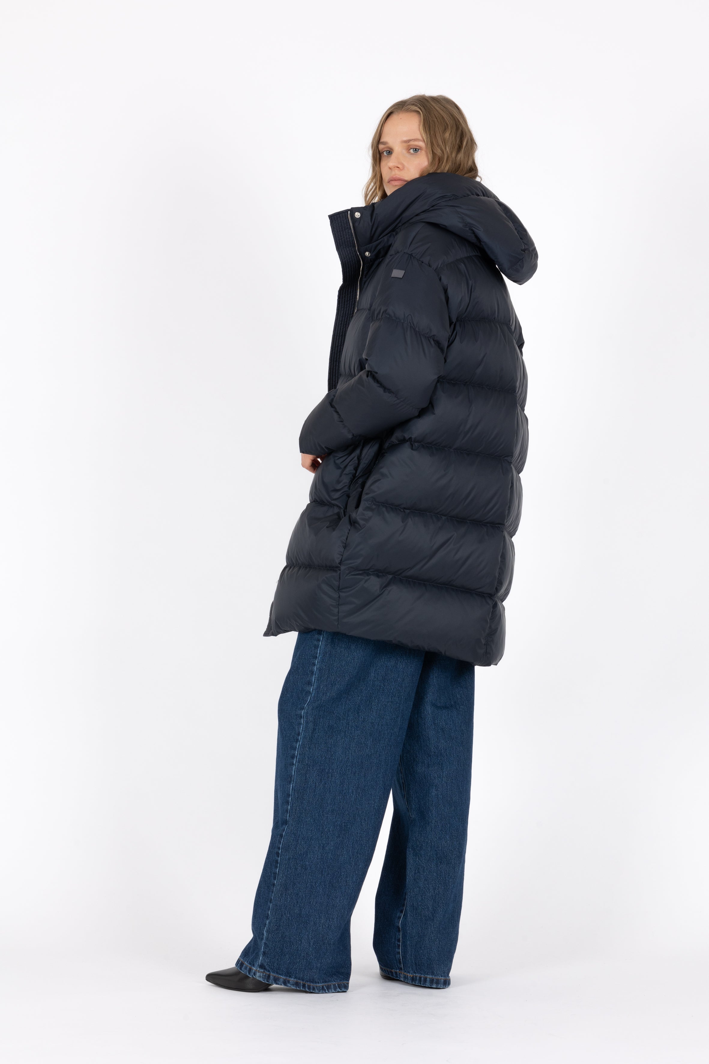 Mid‑length down parka with a cocoon shaped silhouette