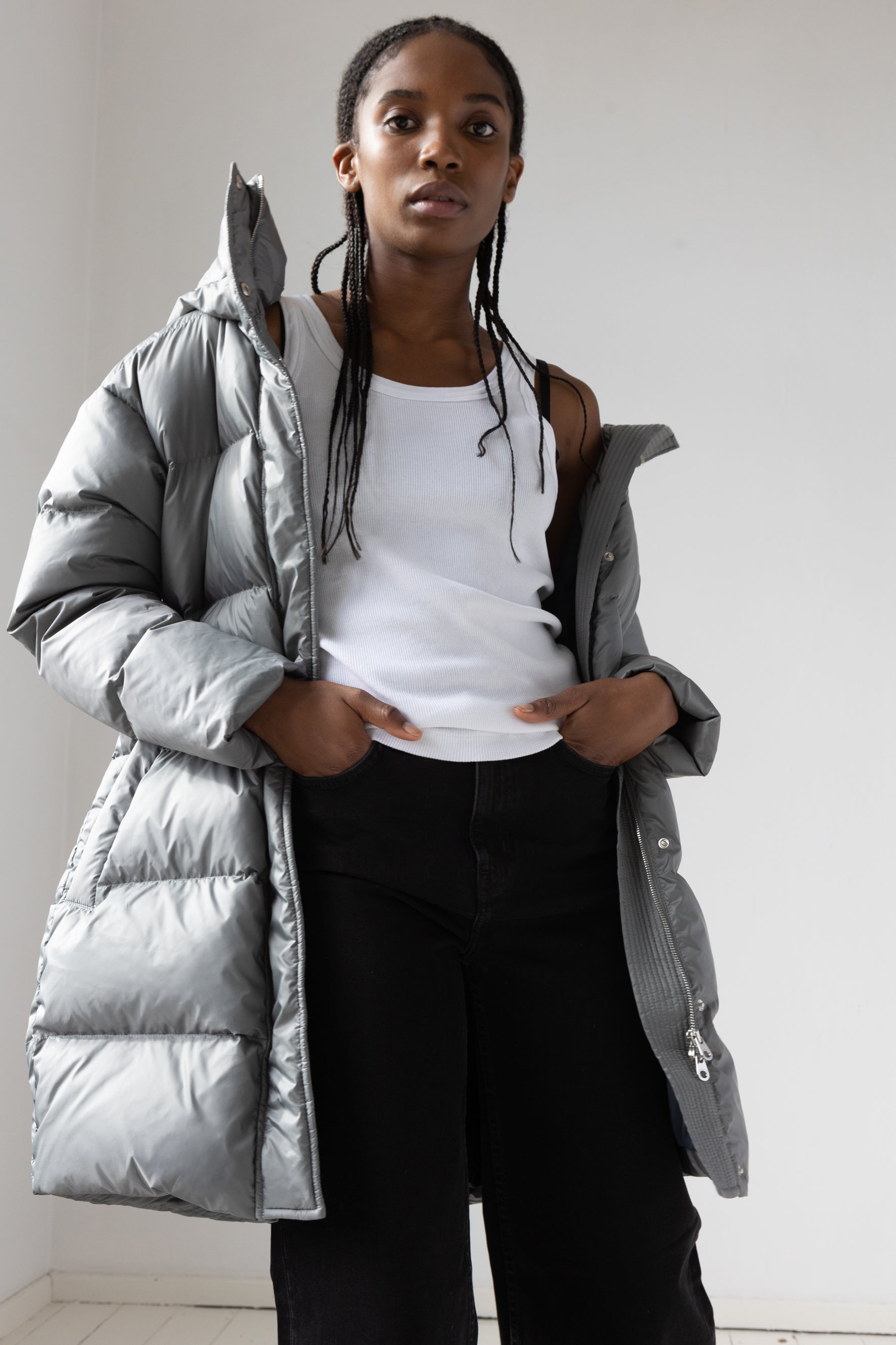Mid‑length down parka with a cocoon shaped silhouette