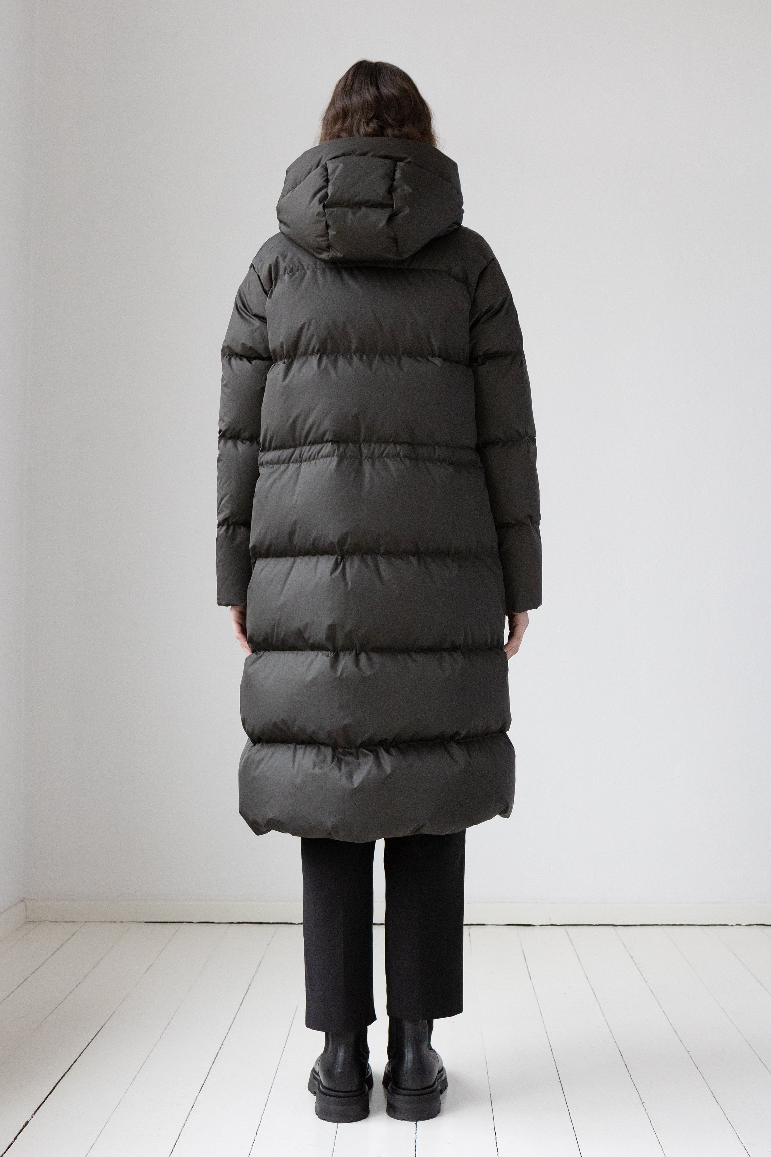 Back of a long down coat in a dark color