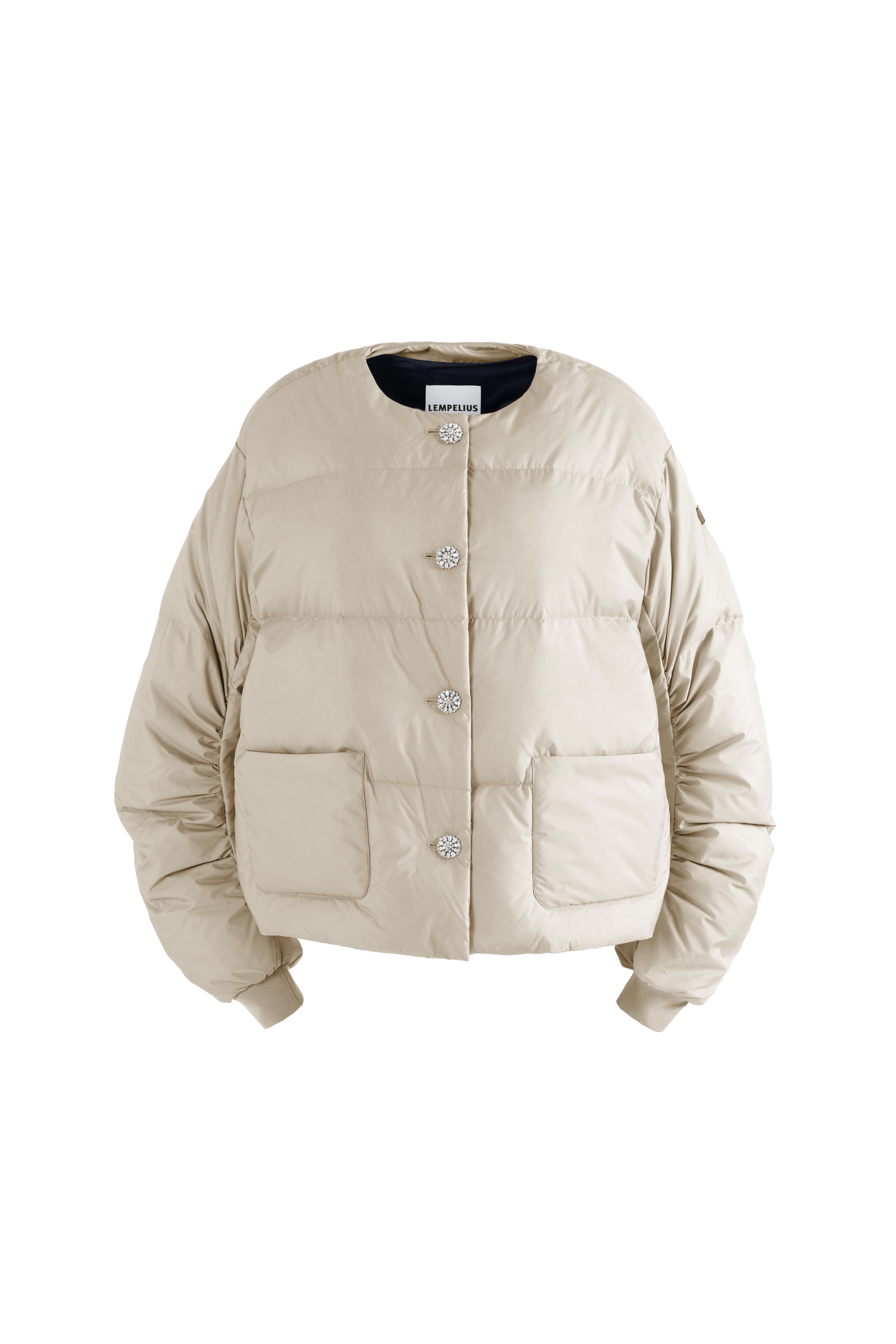 Beige light puffer jacket without collar with gem stones on a white background