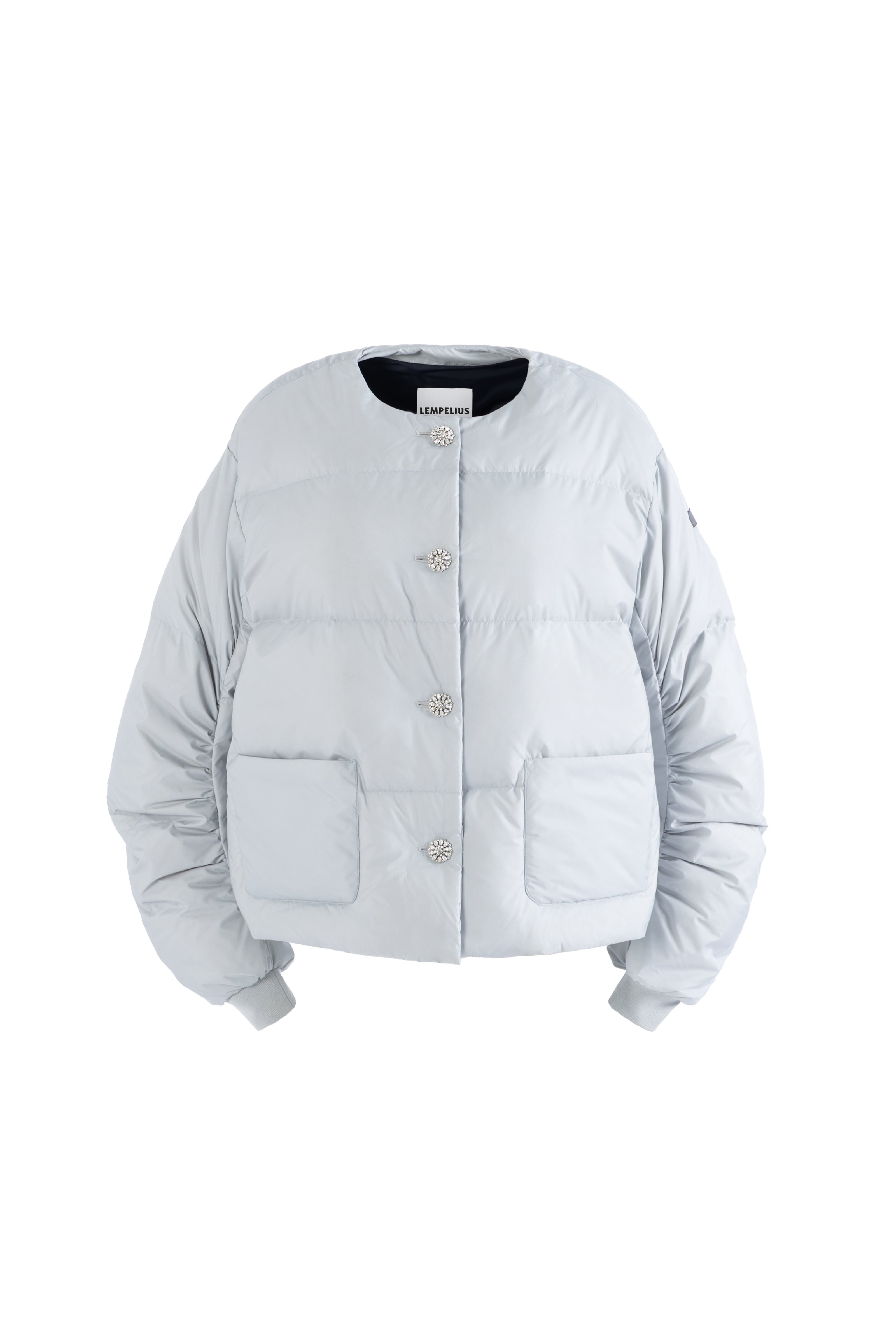 Light gray puffer jacket with silver shiny rhinestone closure on a white background