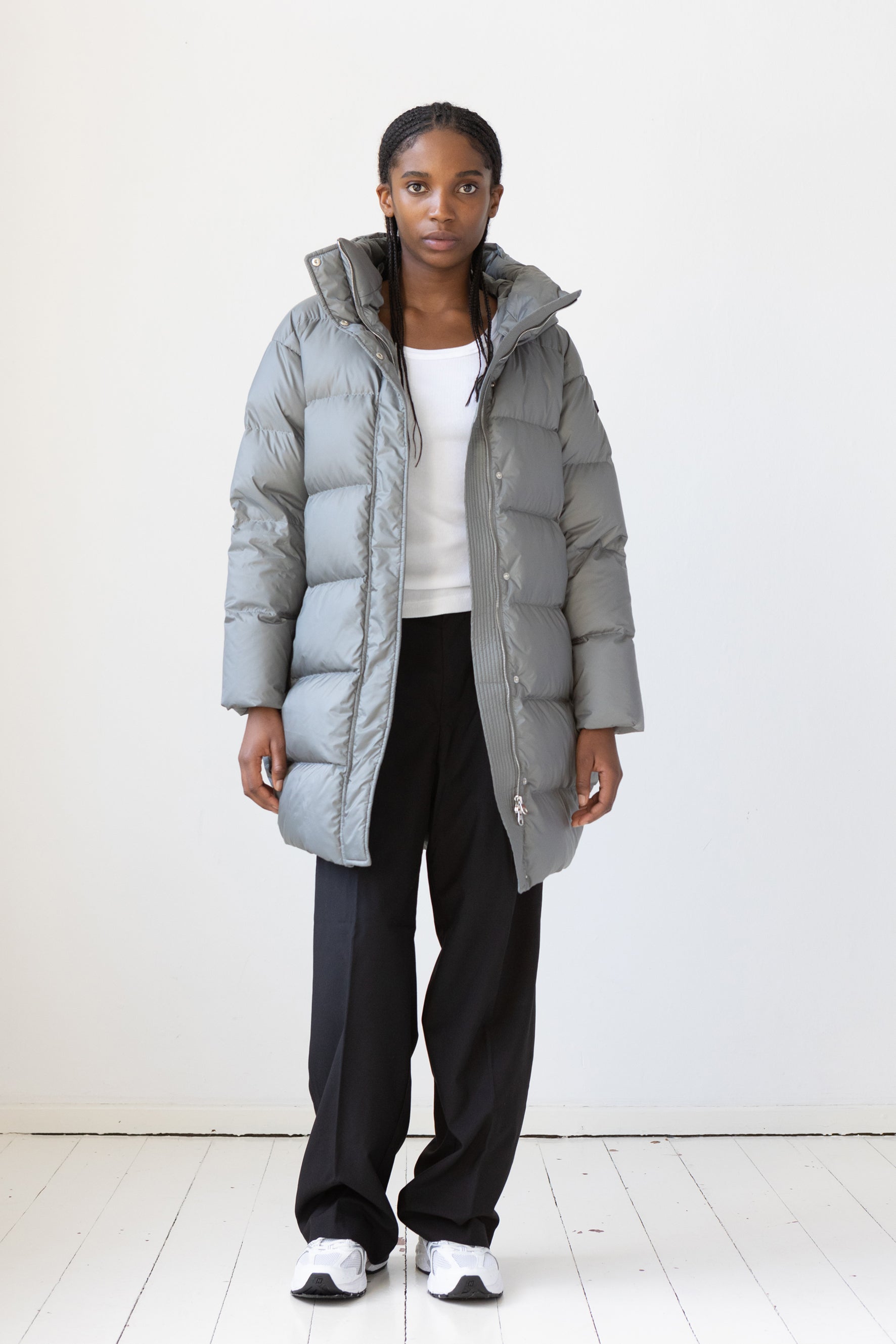 Mid‑length down parka with a cocoon shaped silhouette