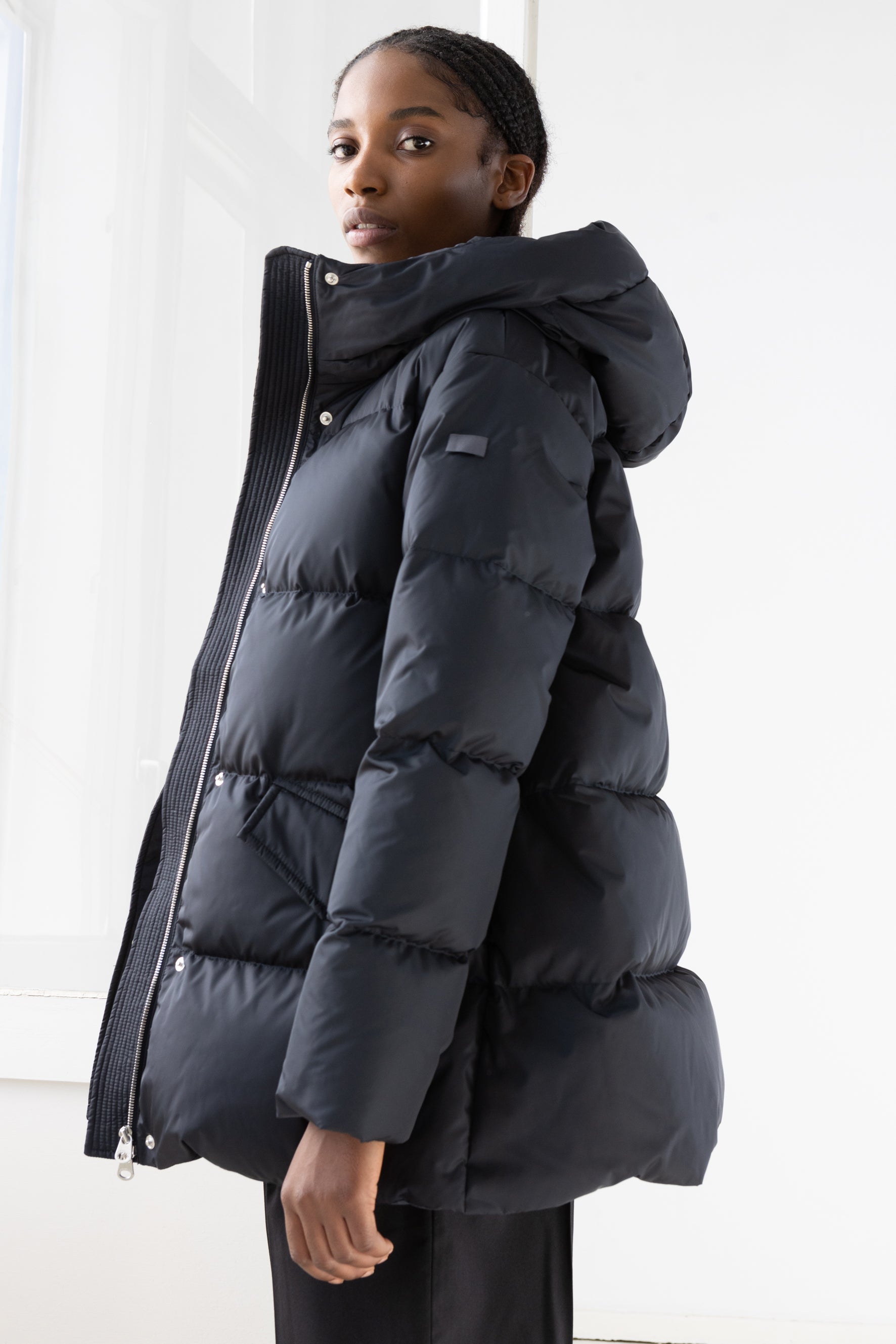 Short quilted down jacket with softly lined hood in dark blue