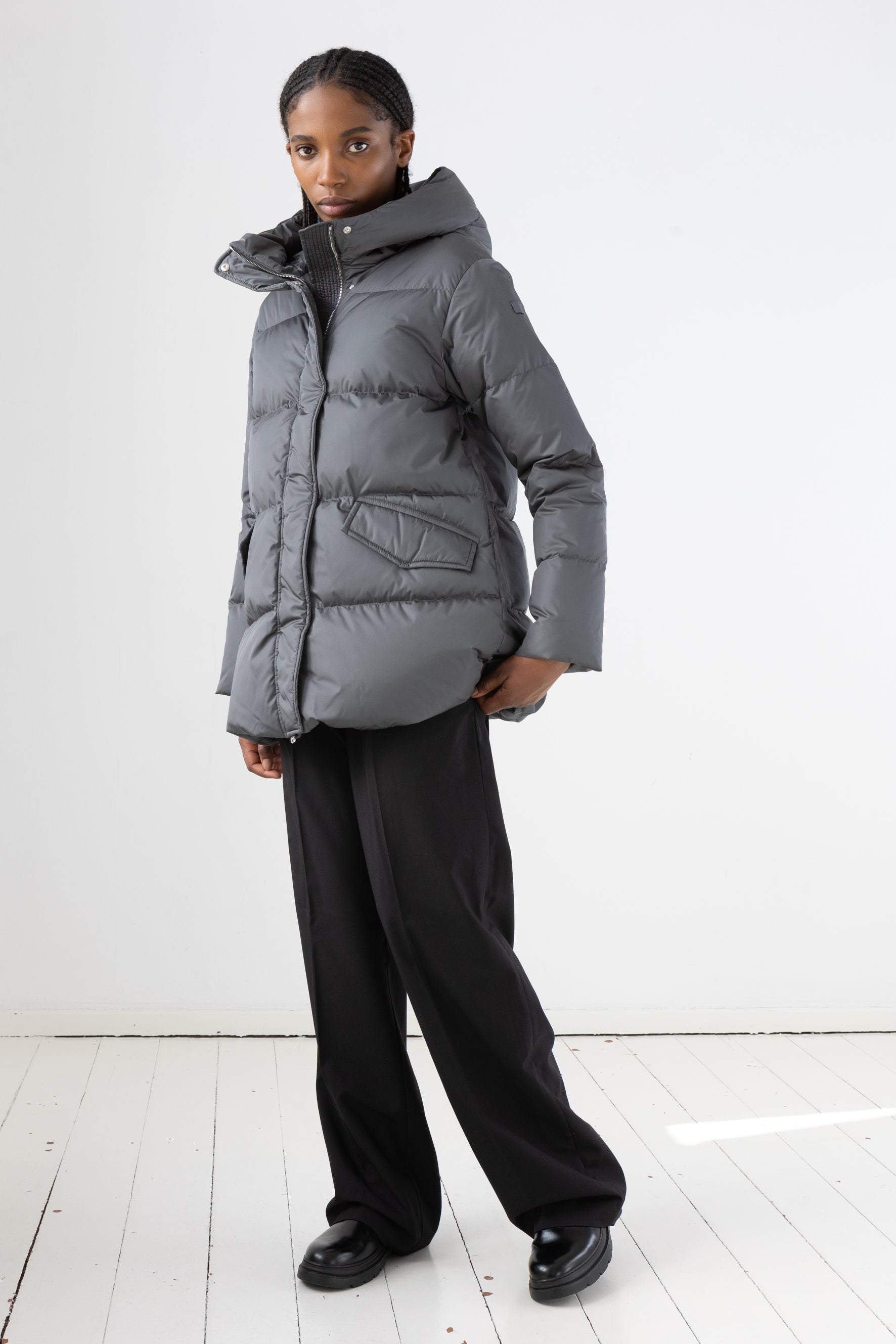 Short quilted down jacket with softly lined hood in iron grey