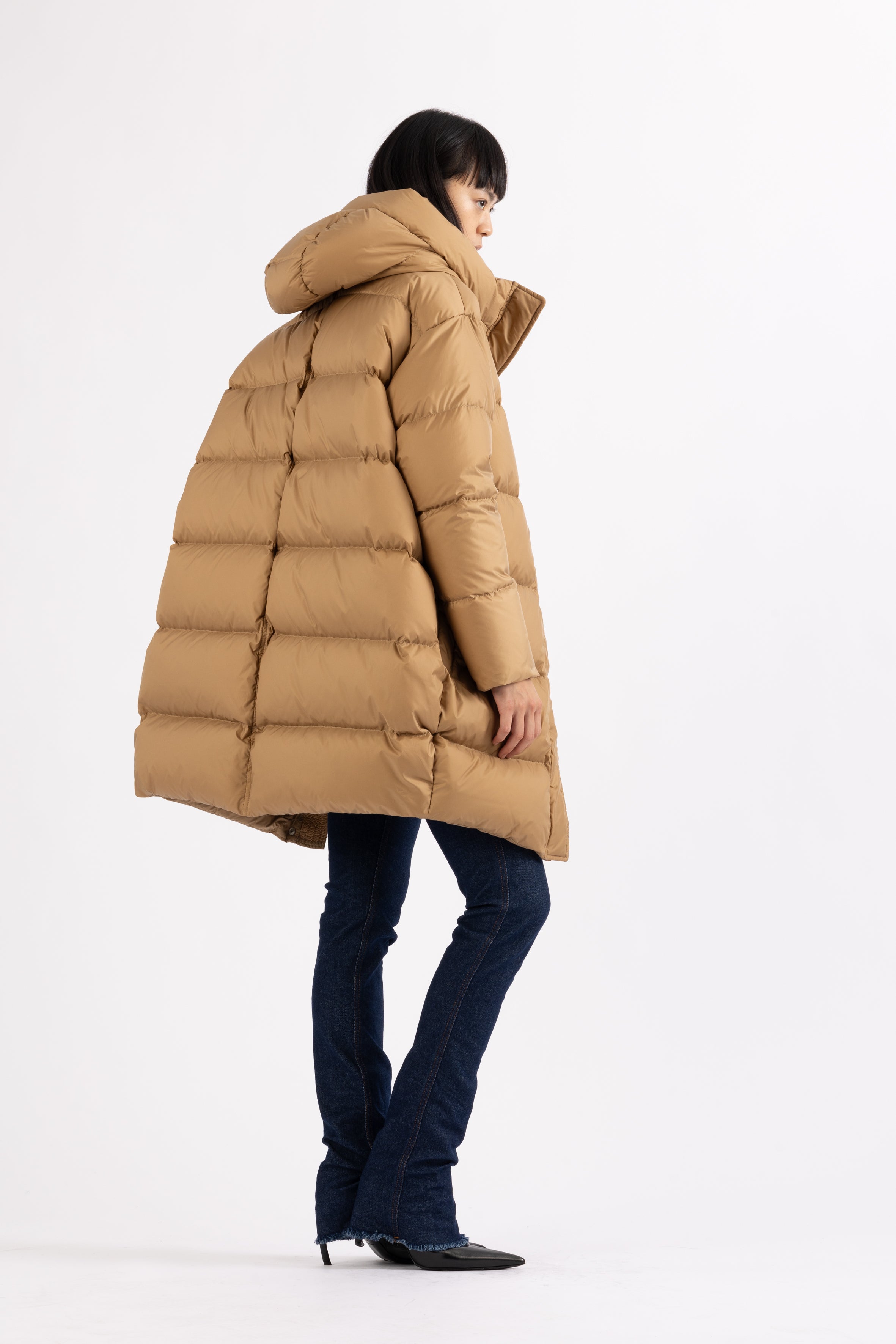 Mid‑length down parka with a cocoon shaped silhouette