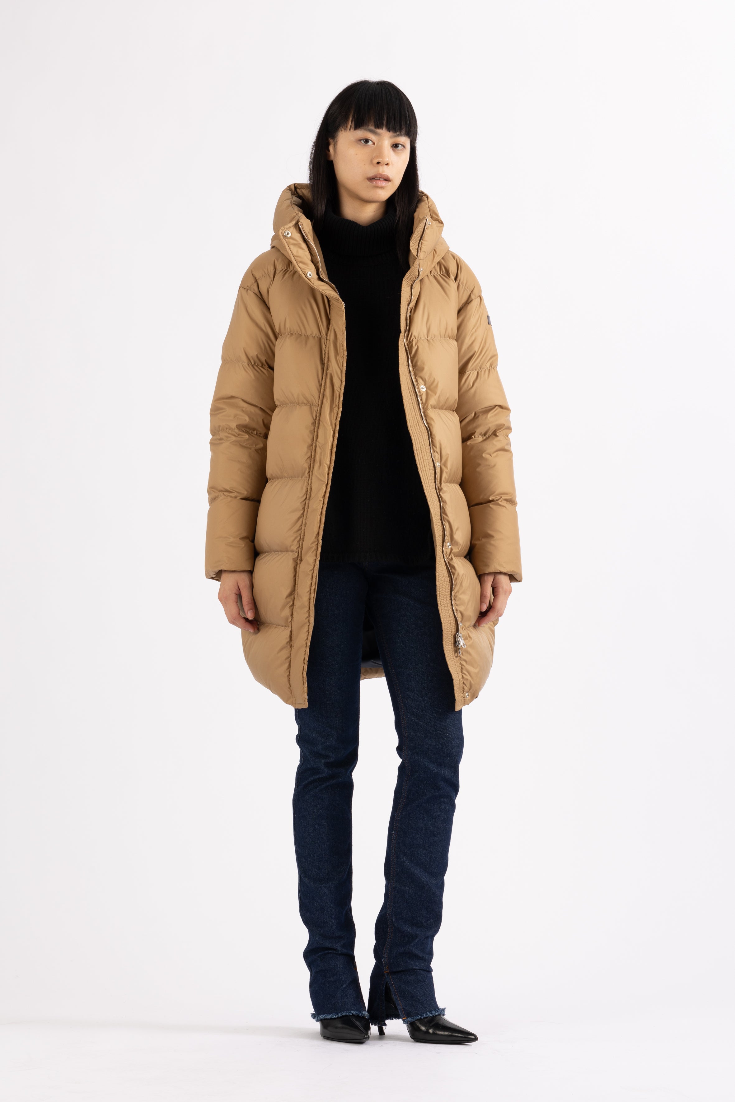 Mid‑length down parka with a cocoon shaped silhouette