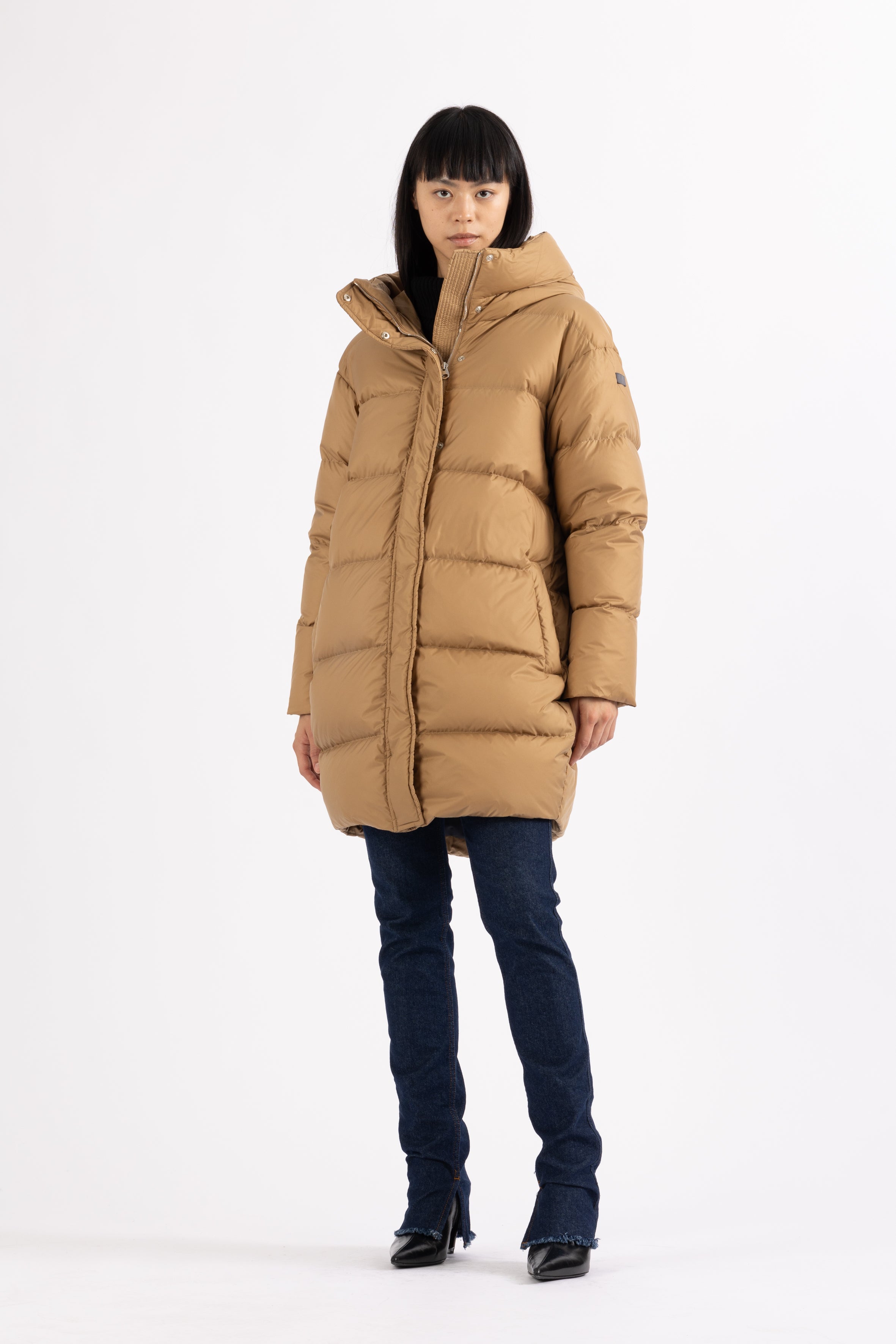 Mid‑length down parka with a cocoon shaped silhouette