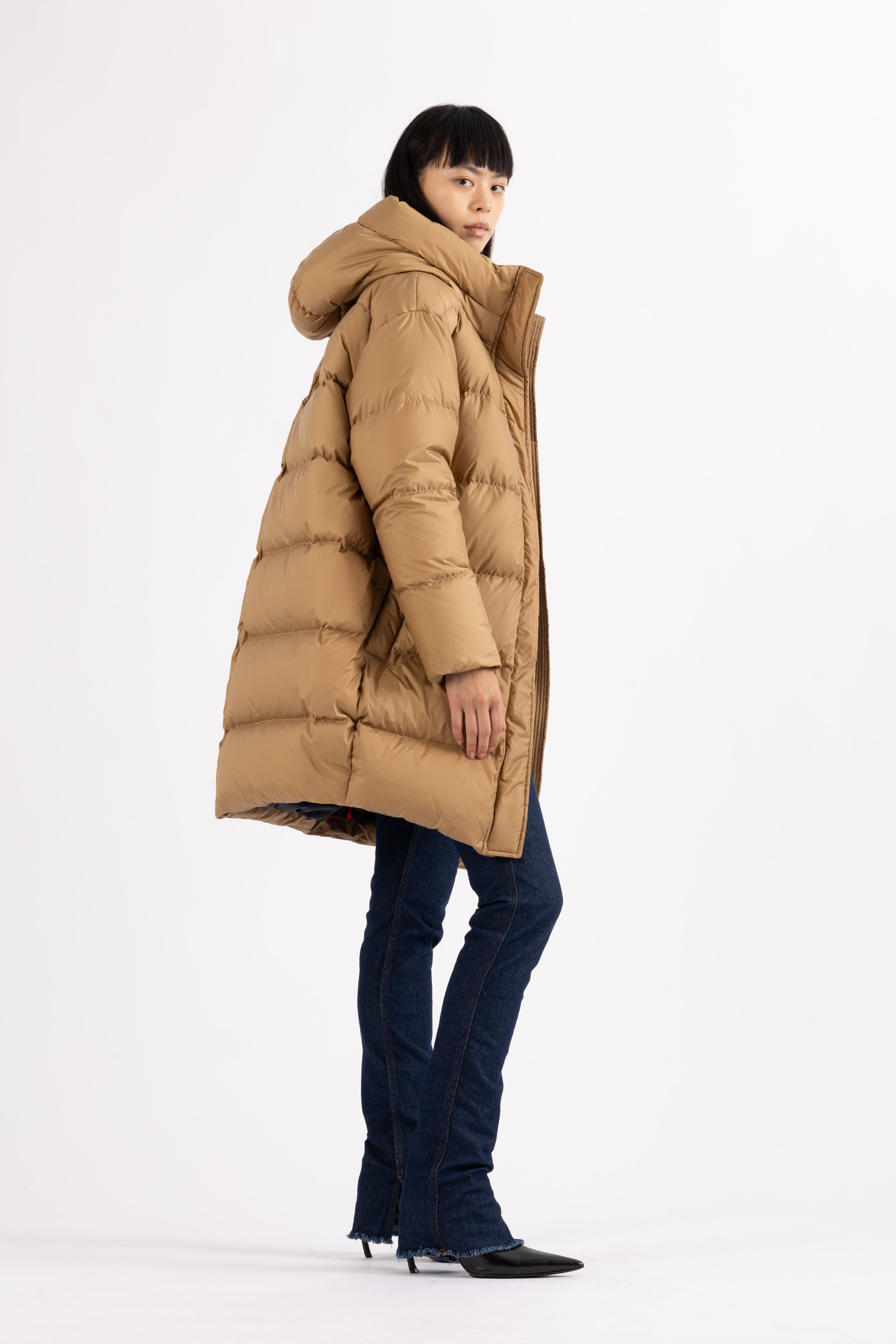 Mid‑length down parka with a cocoon shaped silhouette