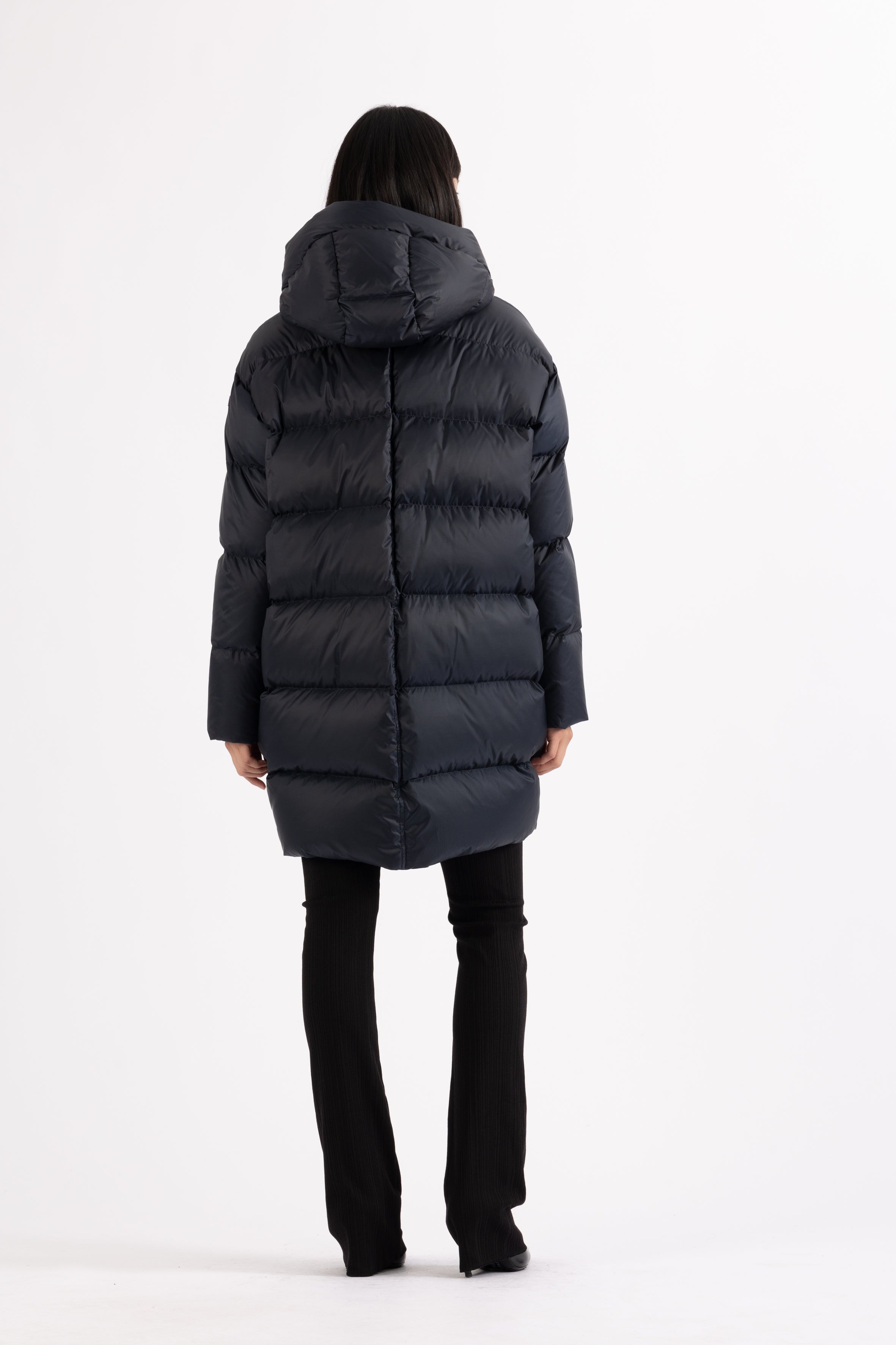 Mid‑length down parka with a cocoon shaped silhouette