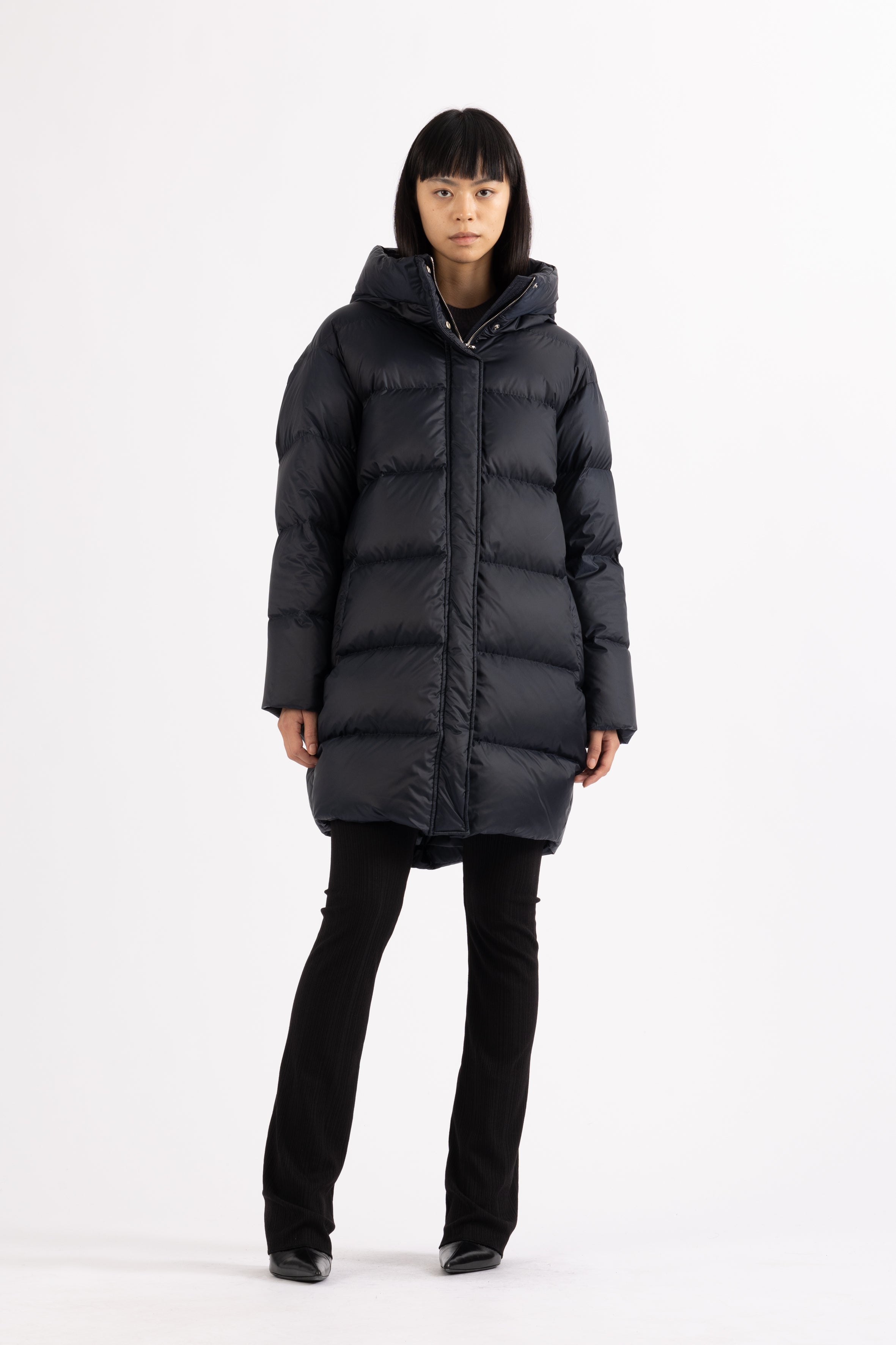 Mid‑length down parka with a cocoon shaped silhouette