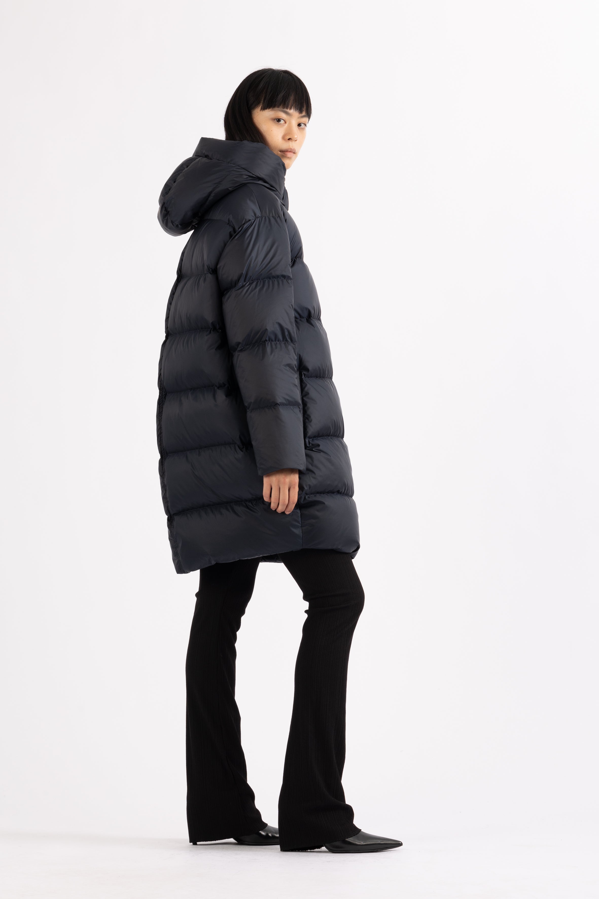 Mid‑length down parka with a cocoon shaped silhouette