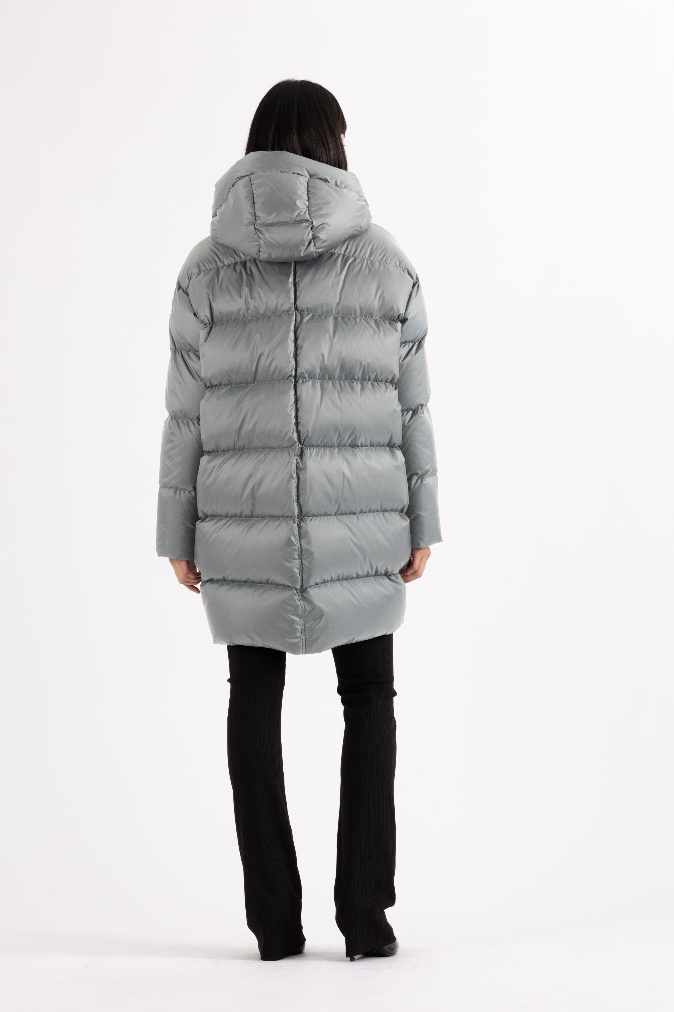 Mid‑length down parka with a cocoon shaped silhouette