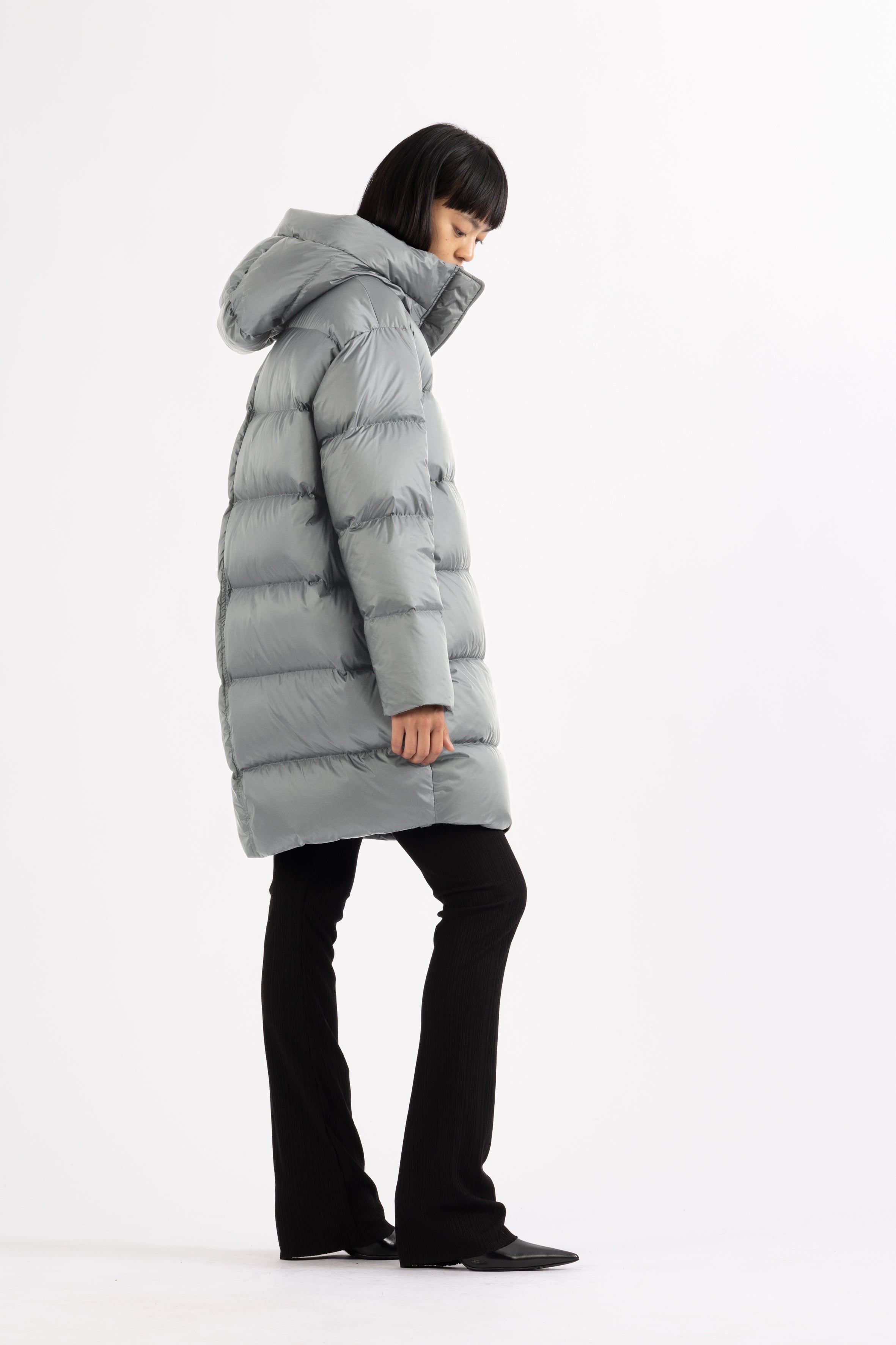 Mid‑length down parka with a cocoon shaped silhouette