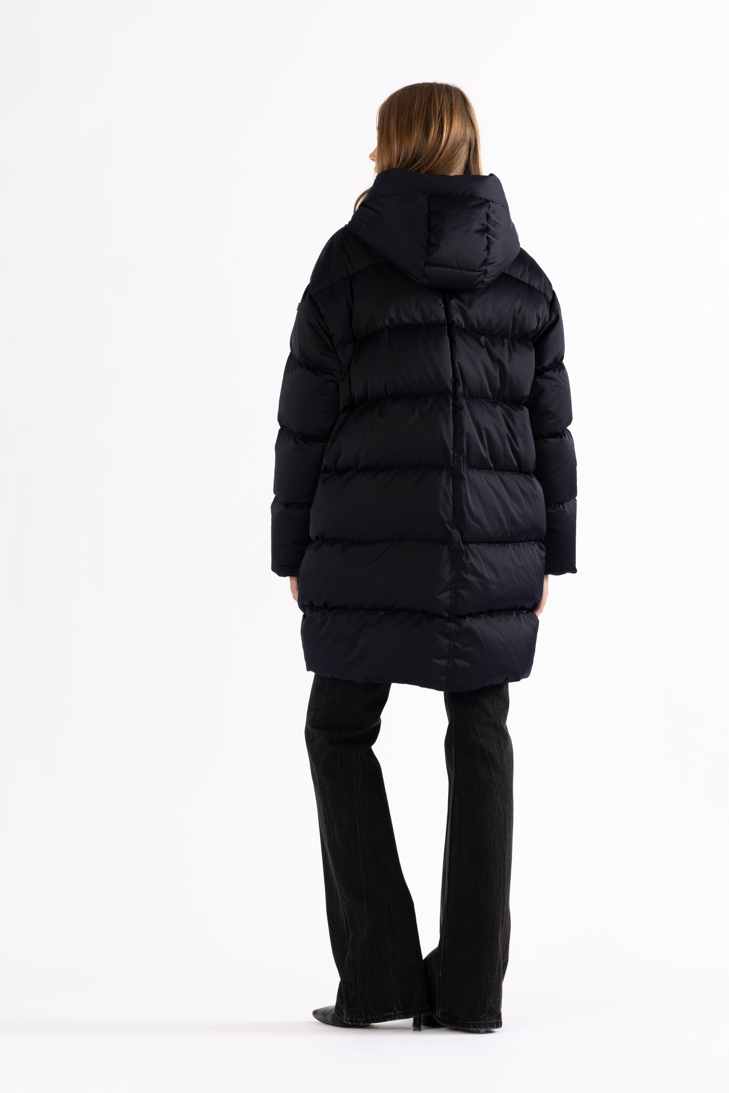Mid‑length down parka with a cocoon shaped silhouette