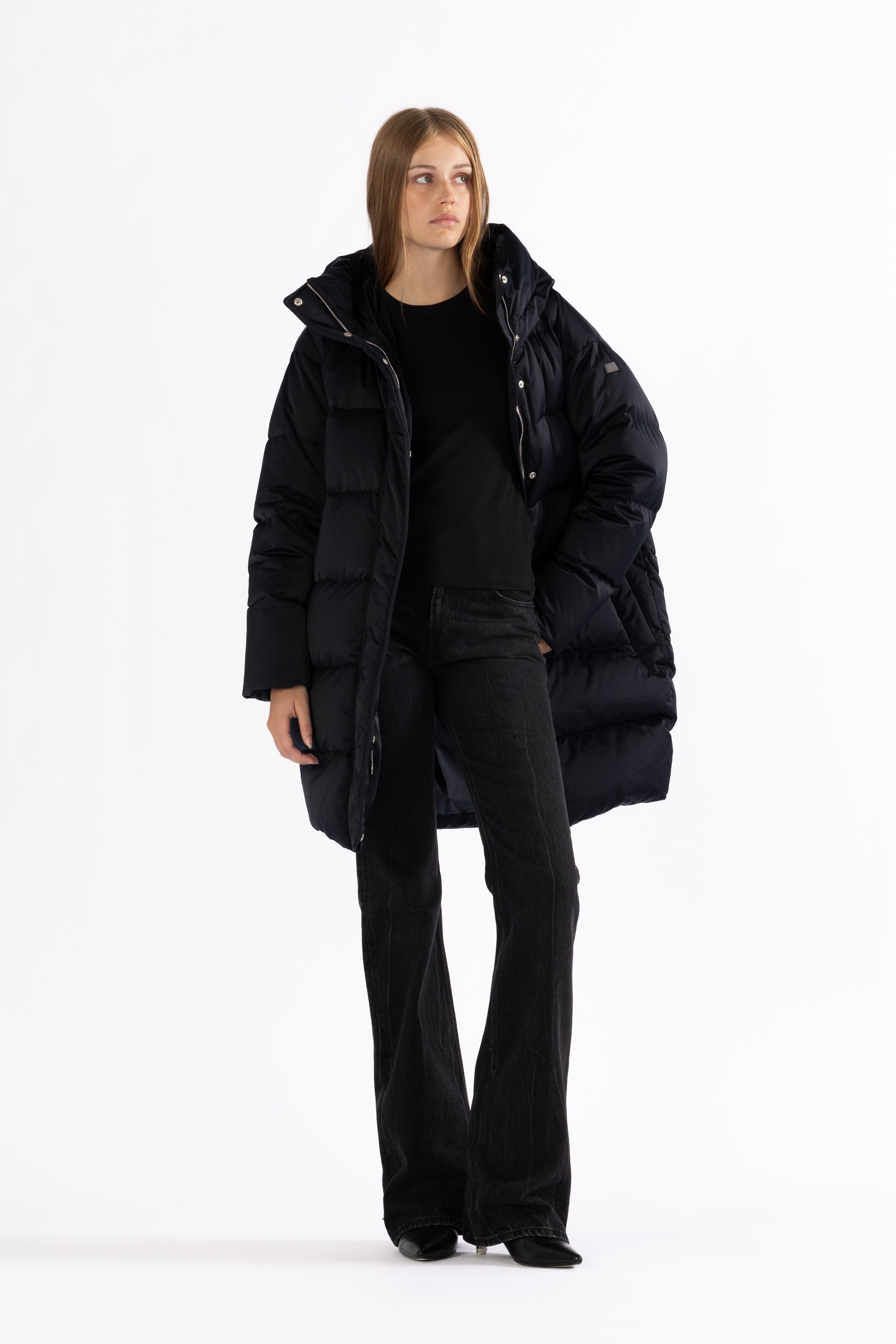 Mid‑length down parka with a cocoon shaped silhouette
