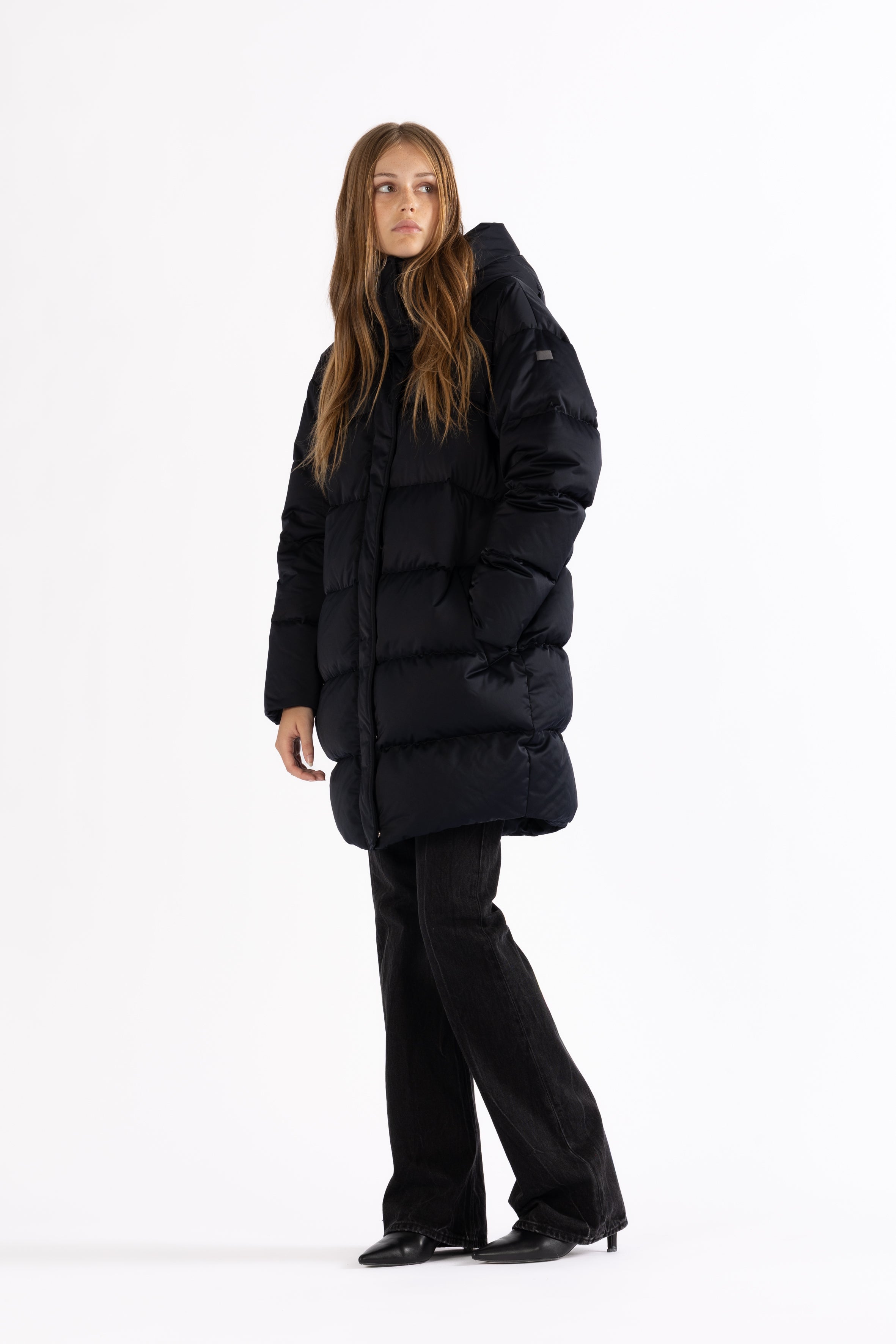 Mid‑length down parka with a cocoon shaped silhouette