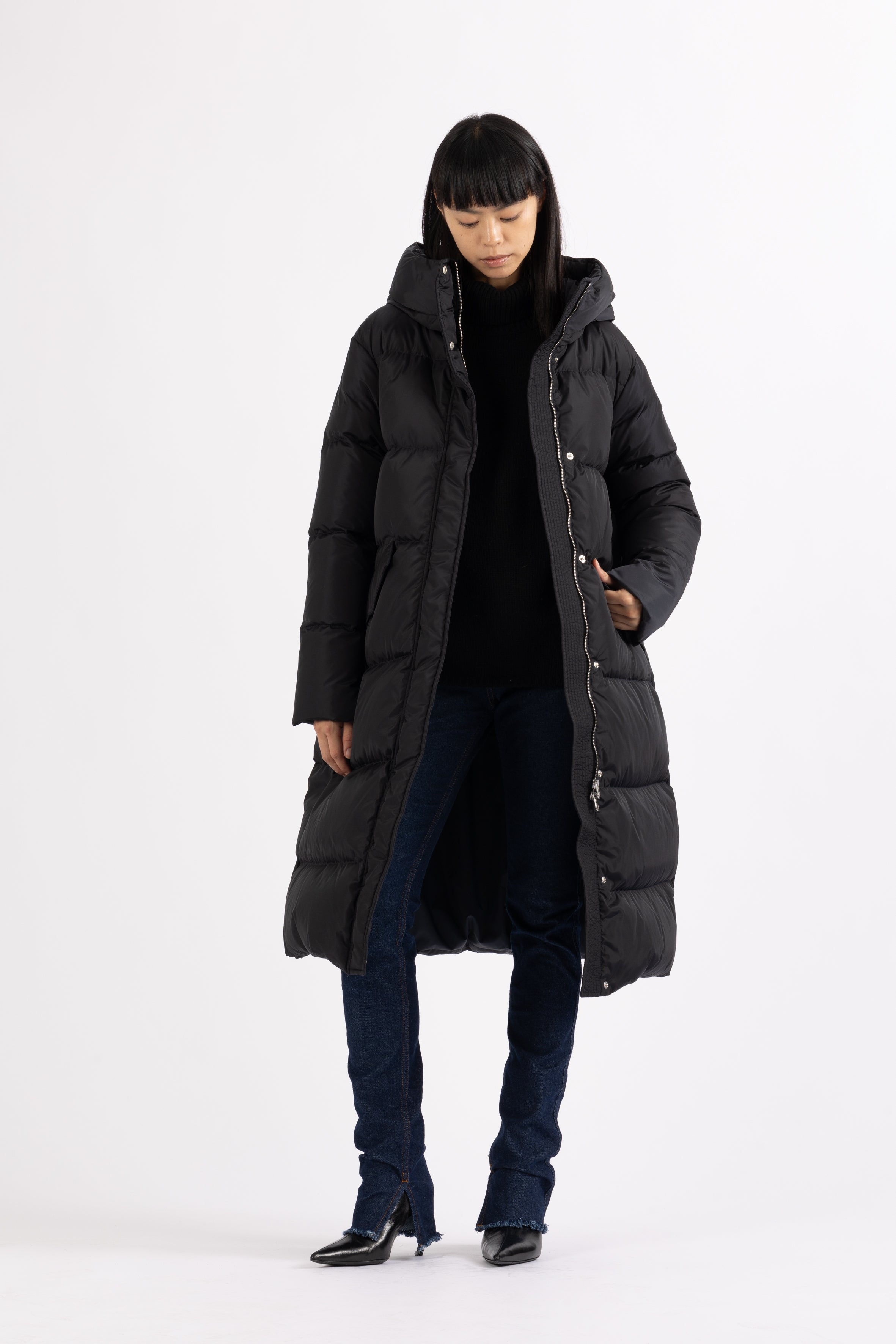 Long Lempelius Downcoat with a slim, slightly flared silhouette in back