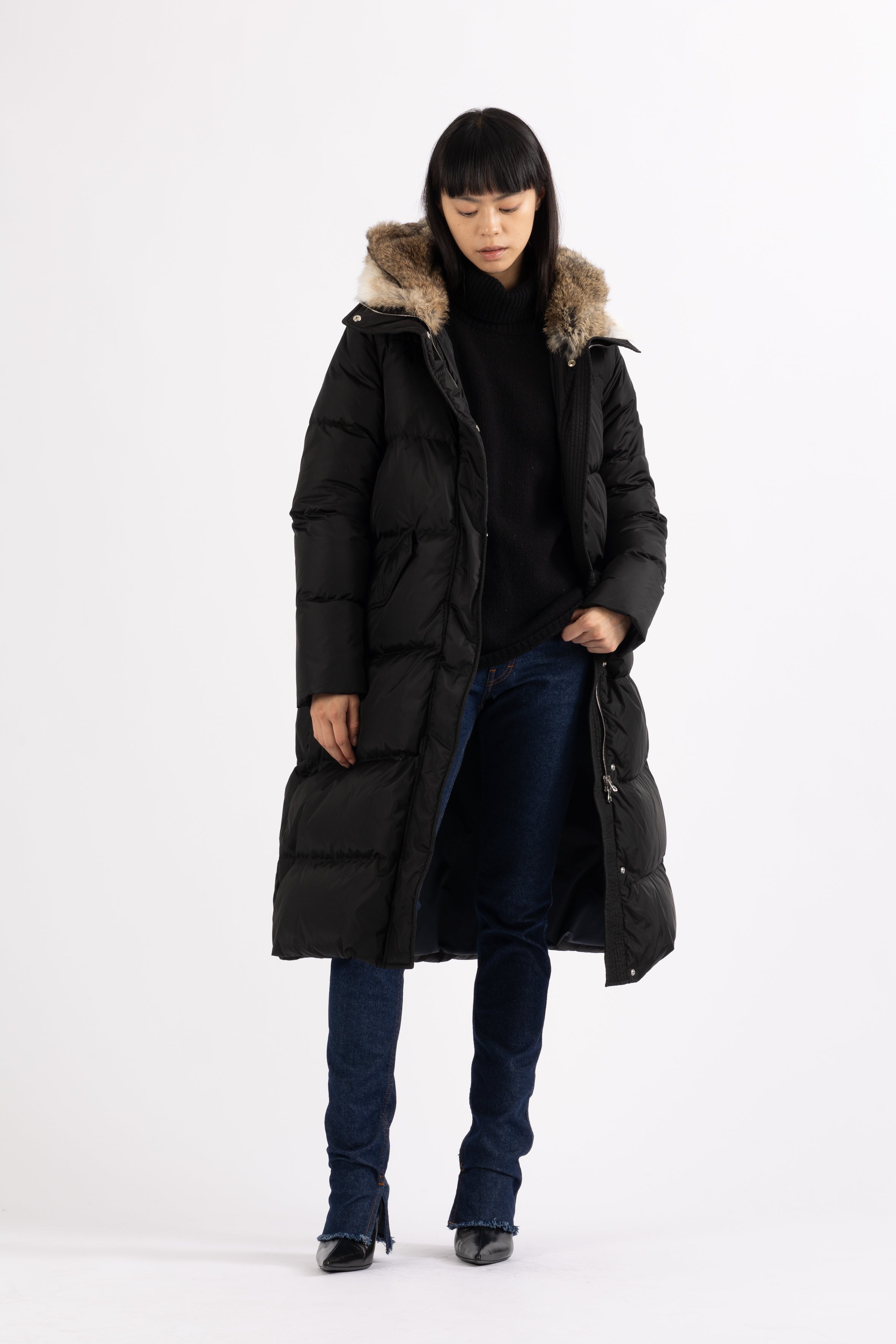 Long Lempelius Downcoat with a slim, slightly flared silhouette in back
and hood with extra soft, removable rabbit fur