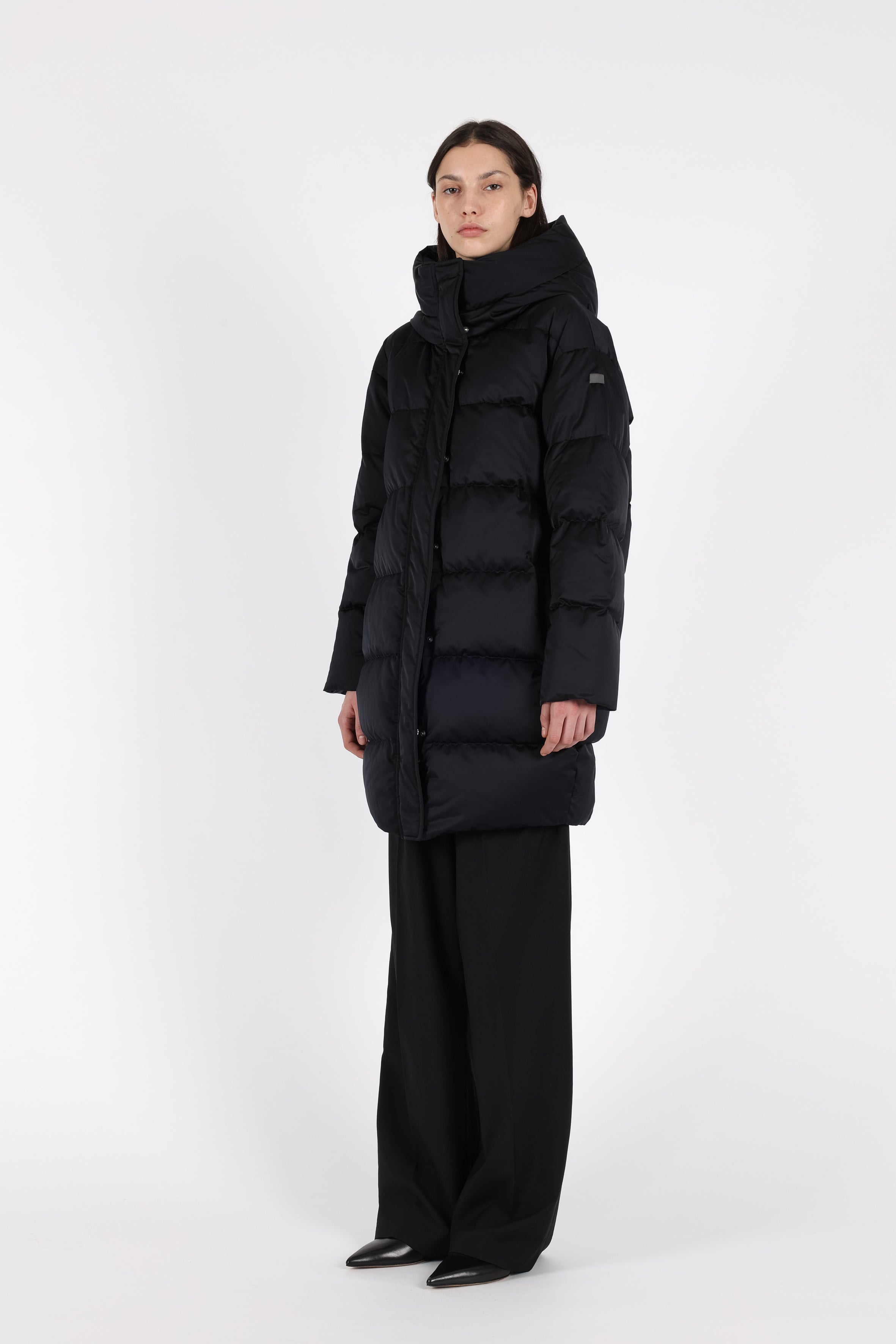 Mid‑length down parka with a cocoon shaped silhouette