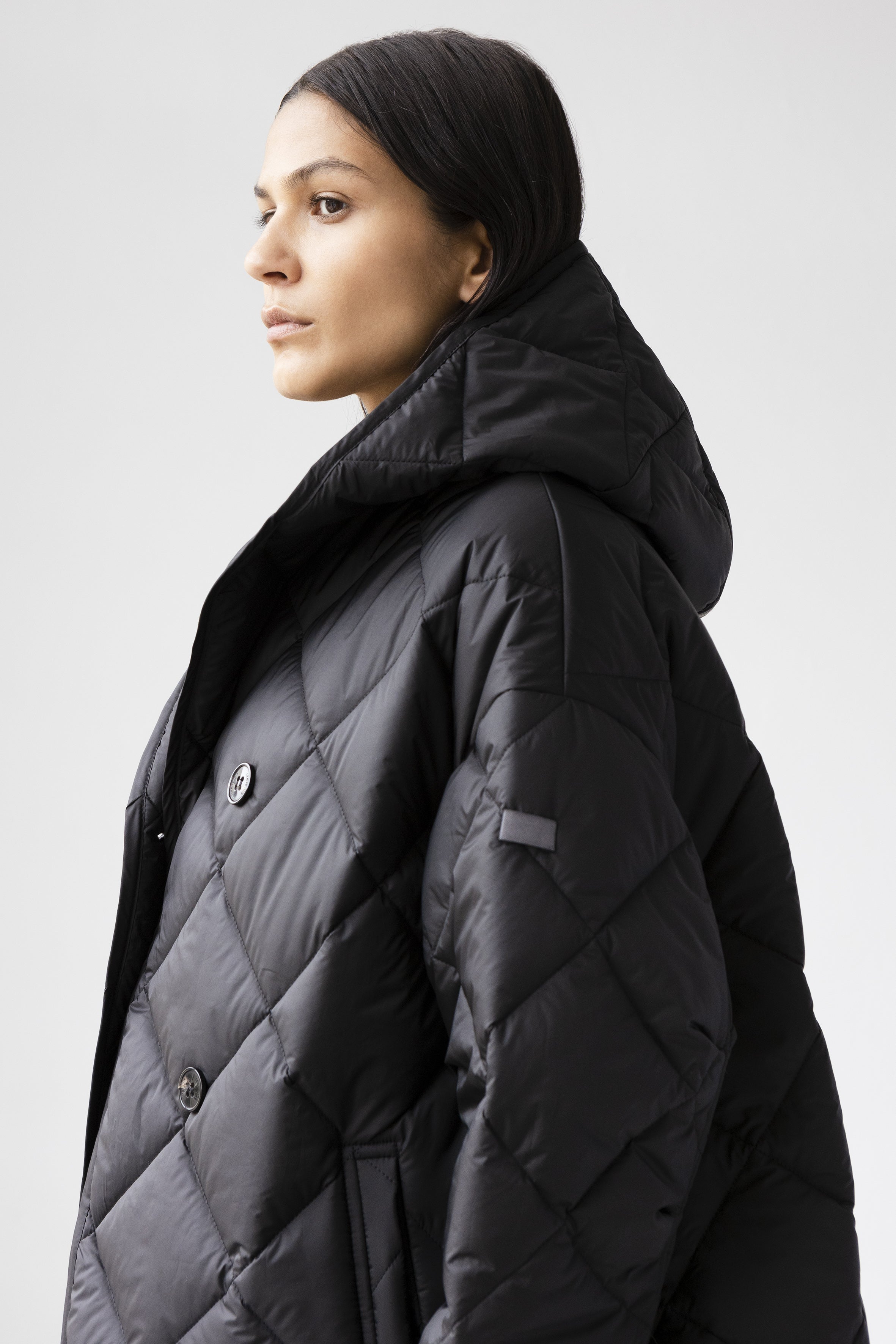 Hooded quilted coat in black