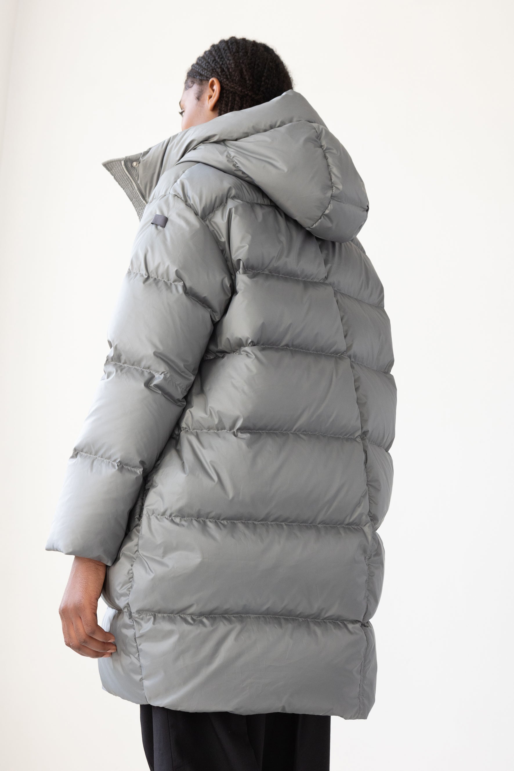 Mid‑length down parka with a cocoon shaped silhouette