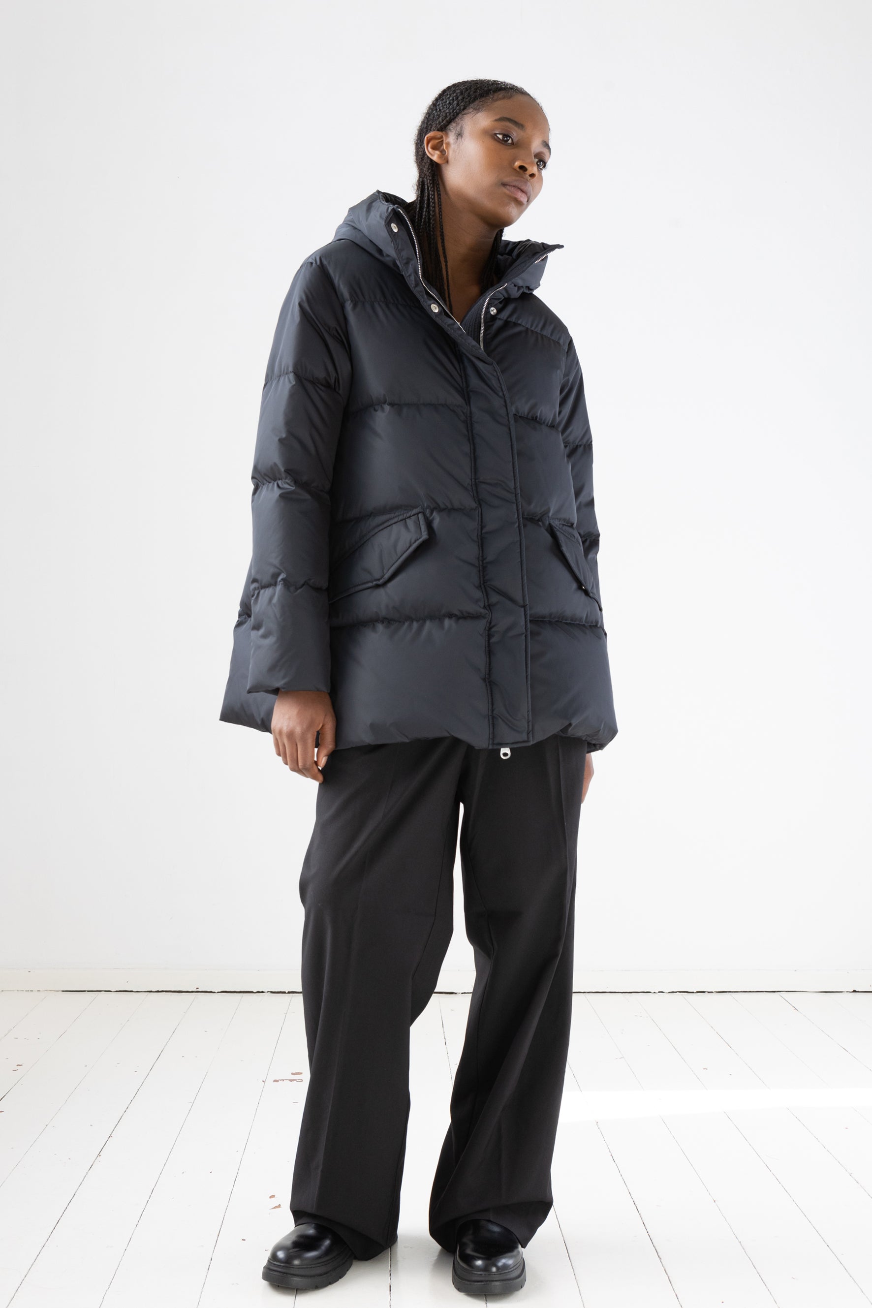 Short quilted down jacket with softly lined hood in dark blue