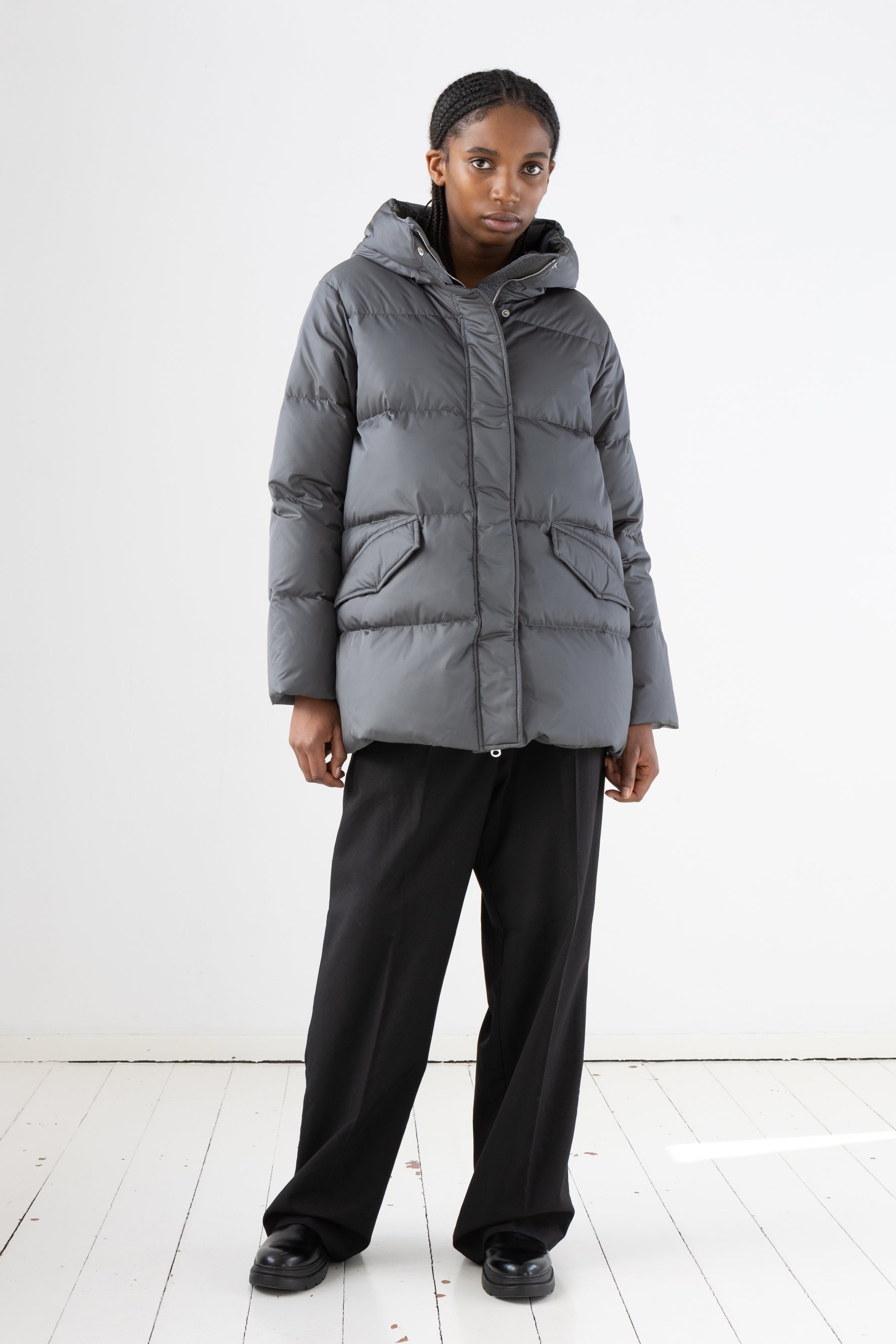 Short quilted down jacket with softly lined hood in iron grey